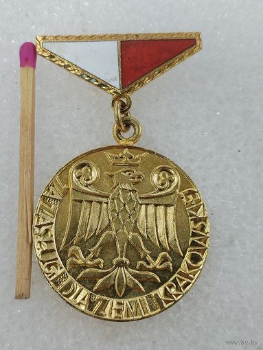 Знак ПНР. За заслуги перед Краковским регионом.