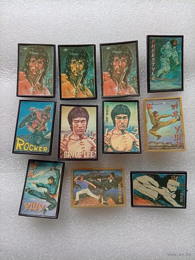 Герои кинофильмов. Сталлоне. Брюс Ли и др. Пластиковые значки. Цена указывается за один значок. #-V-01