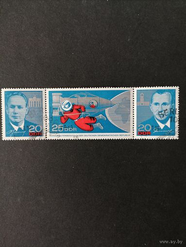 ГДР 1965 Полная серия марок в горизонтальной сцепке "Визит советских космонавтов в ГДР" (спецгашение с клеем, но есть два небольших пятнышка) Mi.1138-1140 каталог 9.00 евро