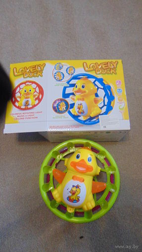 Игрушка утка в колесе