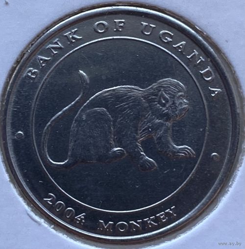 Уганда 100 шиллингов 2004 г. Обезьяна. В холдере