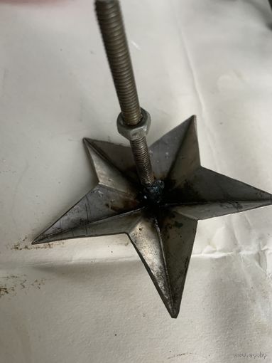 Из расформированной советской военной части  со стенда звезда из нержавейки с длинным штифтом.