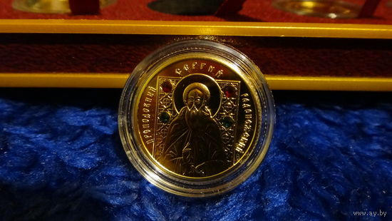 Золото. Святые.  Преподобный Сергий Радонежский . 2013 год. 100 рублей.  Проба золота: 999,9 . 10 гр. Православные святые .