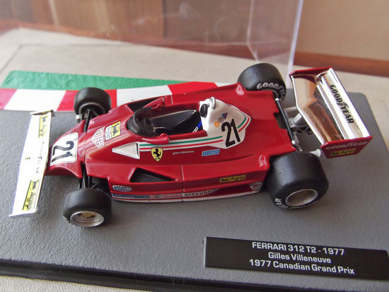 Модель автомобиля 1-43 Фомула 1 Formula 1 F1 Ferrari 312 T2 1977 Gilles Villeneuve 1977 Canadian Grand Prix В комплекте модель, бокс, журнал Состояние модель как новая журнал отличное