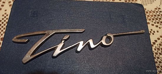 Эмблема на заднюю крышку багажника автомобиля Nissan Almera Tino